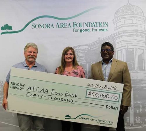 Sonora Area Foundation Board President. Mark Kraft presents check to ATCAA Food Bank Director Deni Avery and ATCAA Executive Director Raj Rambob
